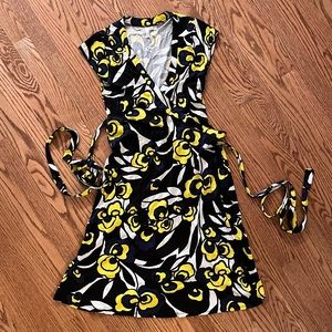 Envi floral wrap dress. Navy, black, yellow and white print.